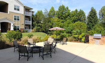 Bbq courtyard with seating at the Haven at Reed Creek Apartments Martinez, GA